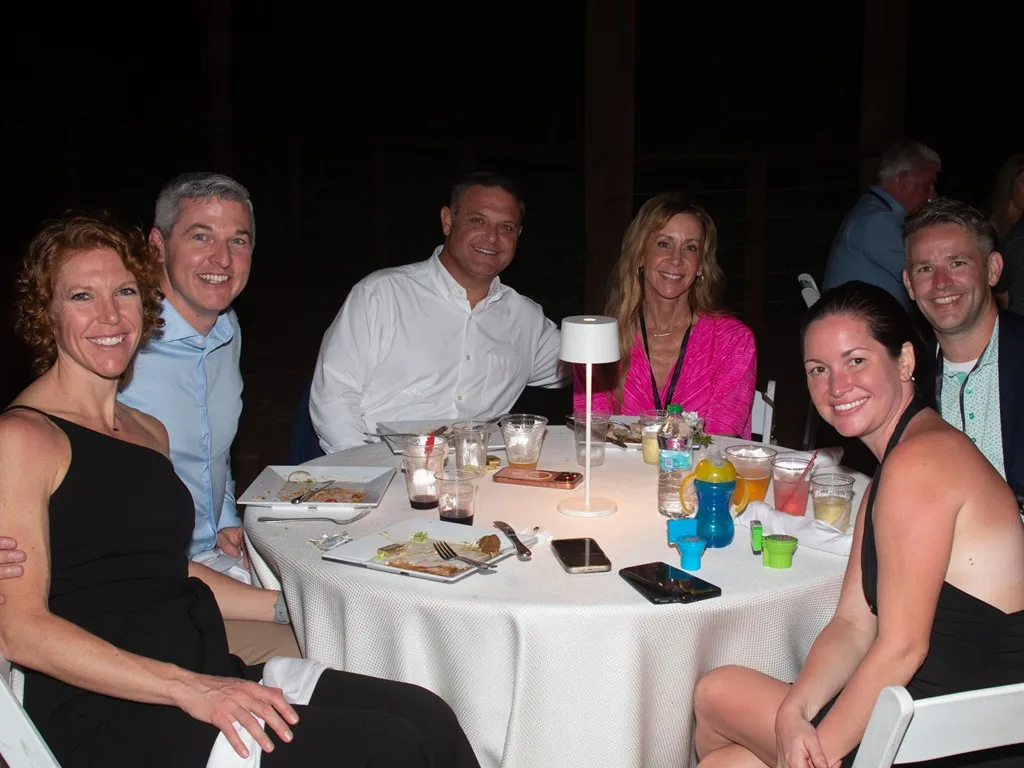 Group of Forum attendees seated together around a dinner table