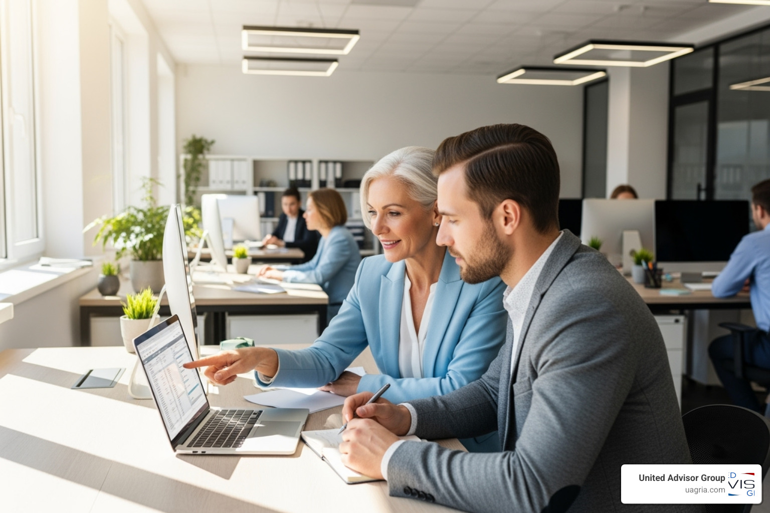 Image of a mentorship session between a senior and junior advisor in a bright, open office - recruiting the next generation of financial advisors Image of a mentorship session between a senior and junior advisor in a bright, open office - recruiting the next generation of financial advisors